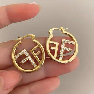 Designer looking F earrings.